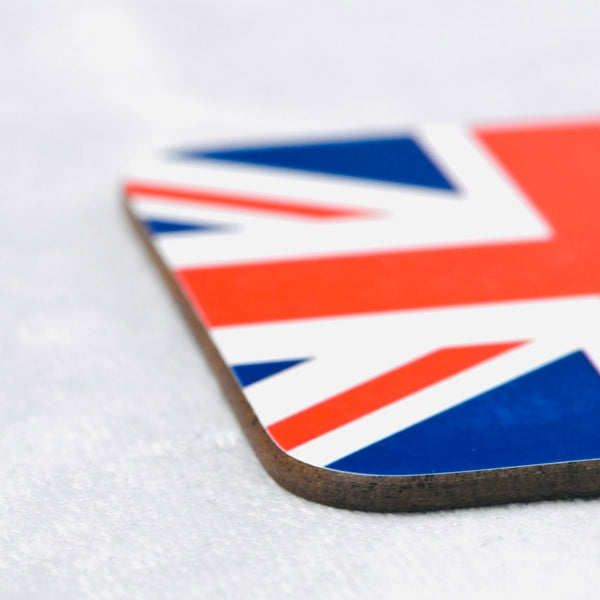 Close up of square wooden coaster with union jack flag printed