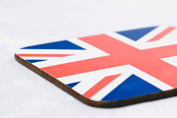 Close up of square wooden coaster with union jack flag printed