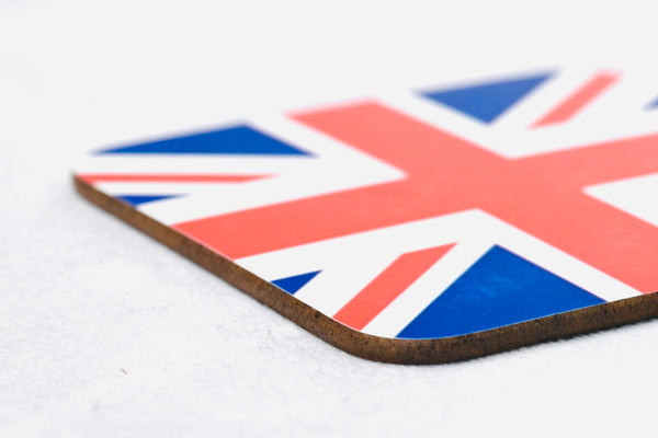 Close up of square wooden coaster with union jack flag printed